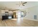 Open concept kitchen with island, white cabinets, and stainless steel appliances at 6045 Scalybark Road, Durham, NC 27712