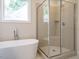 Modern bathroom featuring a large walk-in shower and soaking tub at 6045 Scalybark Road, Durham, NC 27712