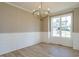 Formal dining room with hardwood floors and wainscoting at 6045 Scalybark Road, Durham, NC 27712
