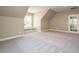 Bright bonus room featuring a built-in window seat and French doors at 6045 Scalybark Road, Durham, NC 27712
