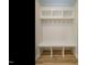 Mudroom with built-in bench, cubbies, and hooks at 6045 Scalybark Road, Durham, NC 27712