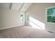 Spacious bedroom with carpeted floors and multiple windows at 6045 Scalybark Road, Durham, NC 27712