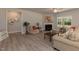 Living Room with corner fireplace, and large windows at 108 Northwood Dr, Fuquay Varina, NC 27526