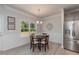 Charming dining room with a table for four and large windows at 108 Northwood Dr, Fuquay Varina, NC 27526