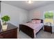 Bright bedroom with double bed, closet, and window offering natural light at 108 Northwood Dr, Fuquay Varina, NC 27526
