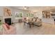 Open living room and kitchen with light flooring at 108 Northwood Dr, Fuquay Varina, NC 27526