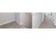 Carpeted staircase with white railings and half wall at 108 Northwood Dr, Fuquay Varina, NC 27526