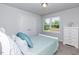 Guest bedroom with double bed, closet, dresser, and window with natural light at 108 Northwood Dr, Fuquay Varina, NC 27526