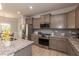 Modern kitchen with stainless steel appliances and granite countertops at 108 Northwood Dr, Fuquay Varina, NC 27526