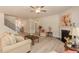 Bright living room features hardwood floors, a fireplace, and ample natural light at 108 Northwood Dr, Fuquay Varina, NC 27526