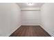 Empty room with dark hardwood floors and wainscoting at 7040 Longstreet Dr # C, Raleigh, NC 27615