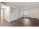 Living room with hardwood floors and built-in shelving unit at 7040 Longstreet Dr # C, Raleigh, NC 27615