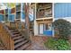 Side view of a building showing stairs and entrance to one unit at 7040 Longstreet Dr # C, Raleigh, NC 27615