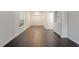 Living room with hardwood floors and built-in shelving at 7040 Longstreet Dr # C, Raleigh, NC 27615