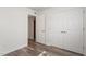 Bright bedroom with double closets and wood-look floors at 7040 Longstreet Dr # C, Raleigh, NC 27615