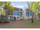 Front view of a two-story building with blue siding, balconies, and landscaping at 7040 Longstreet Dr # C, Raleigh, NC 27615
