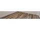 Wood-look flooring in a bright bedroom at 7040 Longstreet Dr # C, Raleigh, NC 27615