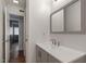 Clean bathroom with gray vanity and a large mirror at 7040 Longstreet Dr # C, Raleigh, NC 27615