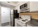 Kitchen features stove, microwave, and refrigerator at 7040 Longstreet Dr # C, Raleigh, NC 27615