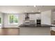 Modern kitchen with white cabinets, dark countertops, and island at 268 Umstead St, Sanford, NC 27330