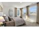 Bright bedroom with large windows and carpeted floor at 732 Apple Churn Dr, Fuquay Varina, NC 27526