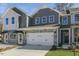 Modern two-story townhome with stone and gray siding at 732 Apple Churn Dr, Fuquay Varina, NC 27526