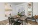 Dining area with built-in bench and large artwork at 732 Apple Churn Dr, Fuquay Varina, NC 27526