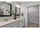Double vanity bathroom with large mirrors and walk-in closet at 732 Apple Churn Dr, Fuquay Varina, NC 27526