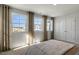 Bedroom with large windows and carpeted floor at 732 Apple Churn Dr, Fuquay Varina, NC 27526