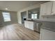Kitchen features white cabinets, granite countertops, and stainless steel dishwasher at 726 Sherrill Farm Dr, Benson, NC 27504