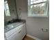 Simple bathroom with granite countertop, single sink vanity, and window at 726 Sherrill Farm Dr, Benson, NC 27504