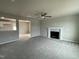 Spacious living room with neutral carpeting and a fireplace at 726 Sherrill Farm Dr, Benson, NC 27504