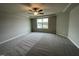 Spacious bedroom with ceiling fan and large window at 726 Sherrill Farm Dr, Benson, NC 27504