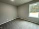 Bright bedroom with carpet and a large window at 726 Sherrill Farm Dr, Benson, NC 27504