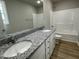 Double vanity bathroom with granite countertop and tub at 726 Sherrill Farm Dr, Benson, NC 27504