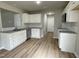 White kitchen with granite countertops and stainless steel appliances at 726 Sherrill Farm Dr, Benson, NC 27504