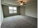 Large bedroom with a ceiling fan and window at 726 Sherrill Farm Dr, Benson, NC 27504