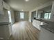 Bright dining area with hardwood floors and kitchen access at 726 Sherrill Farm Dr, Benson, NC 27504