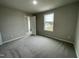 Well-lit bedroom with carpet and a walk-in closet at 726 Sherrill Farm Dr, Benson, NC 27504