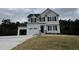 Two story home with a two car garage and landscaping at 726 Sherrill Farm Dr, Benson, NC 27504