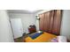 Bright bedroom with double bed, window, and brown curtains at 108 N Charles St, Roxboro, NC 27573