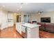 Modern kitchen with granite island, stainless steel appliances, and ample cabinet space at 1133 Chapanoke Rd, Raleigh, NC 27603