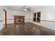 Bright living room featuring a brick fireplace and hardwood floors at 605 Wellington Dr, Zebulon, NC 27597