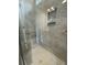 Large walk-in shower with marble-look tile and built-in seat at 137 Swain St, Clayton, NC 27527