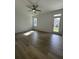Spacious bedroom with hardwood floors and a door leading outside at 137 Swain St, Clayton, NC 27527