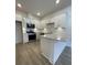 Modern kitchen with white cabinets and quartz countertops at 137 Swain St, Clayton, NC 27527