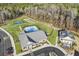 Aerial view of community amenities including pool, clubhouse, and sports courts at 137 Swain St, Clayton, NC 27527