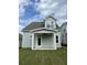 Two-story home with covered patio and landscaping at 137 Swain St, Clayton, NC 27527