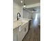 Modern farmhouse kitchen with white cabinets and a large island at 124 Swain St, Clayton, NC 27527