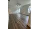 Bright bedroom with wood-look floors and a ceiling fan at 124 Swain St, Clayton, NC 27527